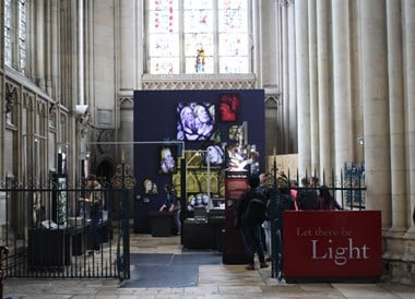 Image showing the layout of a temporary exhibition at York Minster showcasing the project to conserve the Great East Window. The exhibition is called Let There Be Light.