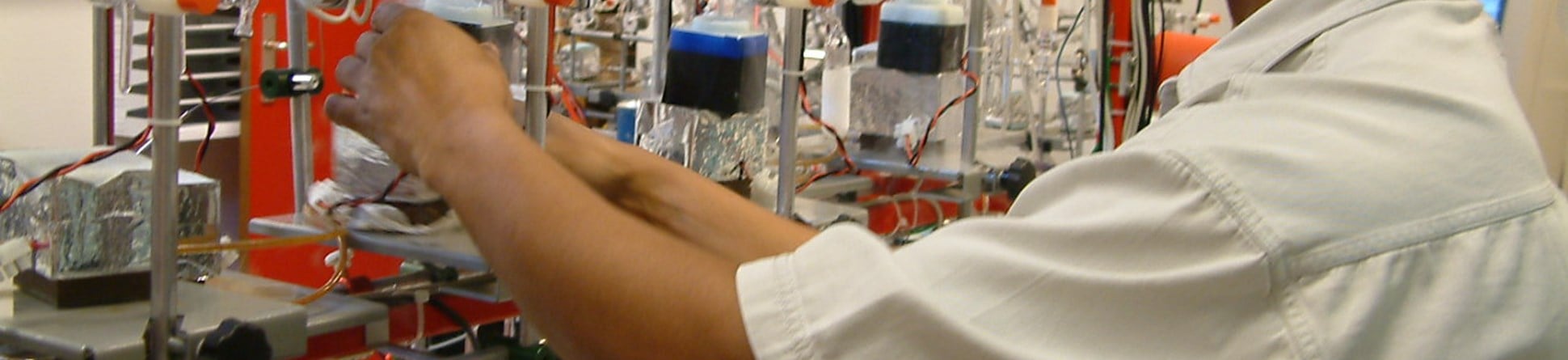 Scientist in laboratory preparing a sample for radiocarbon dating.