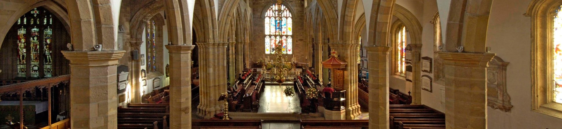 Interior of priory church, Lancaster, Lancashire showing arches of the 14th century aisle arcades