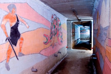 St John’s School, Redhill, Surrey, murals in the school’s air raid shelter, in the foreground a stylised St George is shown fighting a dragon. © Historic England DP 015688.