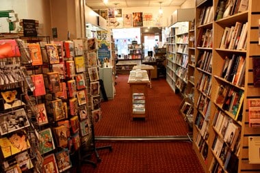 Rows of bookshelves inside Gay's The Word bookshop