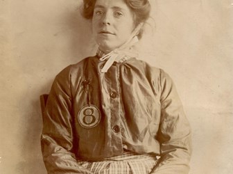 Photograph of Annie Kenney, The WSPU Bristol branch organiser and active militant protestor, in prison uniform.