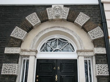 Doorway to Bedford Ladies' College provides an example of Eleanor Coade's (1733-1821) decorative stoneware, manufactured at her Lambeth factory and widely used by Georgian architects and garden designers © Cheryl Law (2010) Source Historic England.NMR.