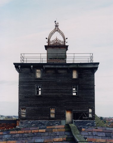 Tower on the north end of the Spinning Mill which contained grain elevators for transferring sprouting malt from the malt floors to the Kiln