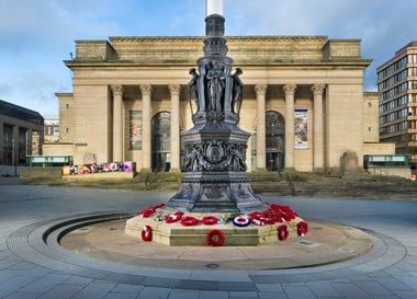 Image of Sheffield War Memorial, Barker’s Pool, Sheffield, South Yorkshire, newly upgraded to II*. This unusual but striking flagpole decorated with bronze sculptures at its base commemorates the men of Sheffield who died during the World Wars. Remembered among them are the Sheffield Pals, of whom over 500 were killed or injured on the first day of the Somme.