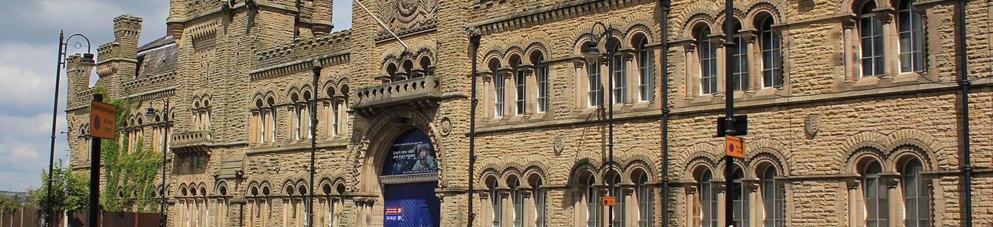 Bury, Castle Street, Drill Hall, 1868, its impressive stone–faced, gothic style frontage with crenulations was designed by Henry Styan and James Farrier, it is Grade II listed.