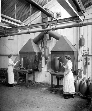 Cunard’s Shell Works, Liverpool, August 1917 Women using spray guns to apply varnish to the surface of completed heavy artillery shells.