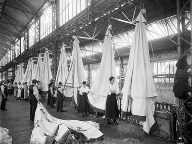 Workers packing tents at Waring & Gillow's, London