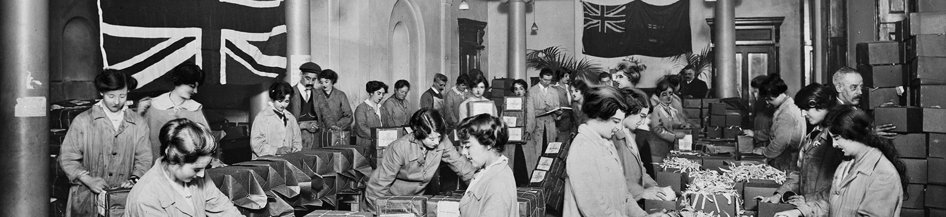 16 Regent Street, London, in a crowded room volunteers at the Australian Red Cross building pack parcels for prisoners of war