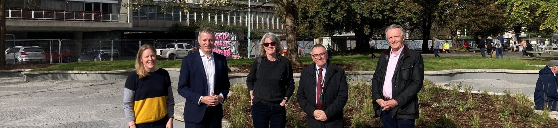 Five people visit Plymouth's Civic Square with newly repaired paving and street furniture