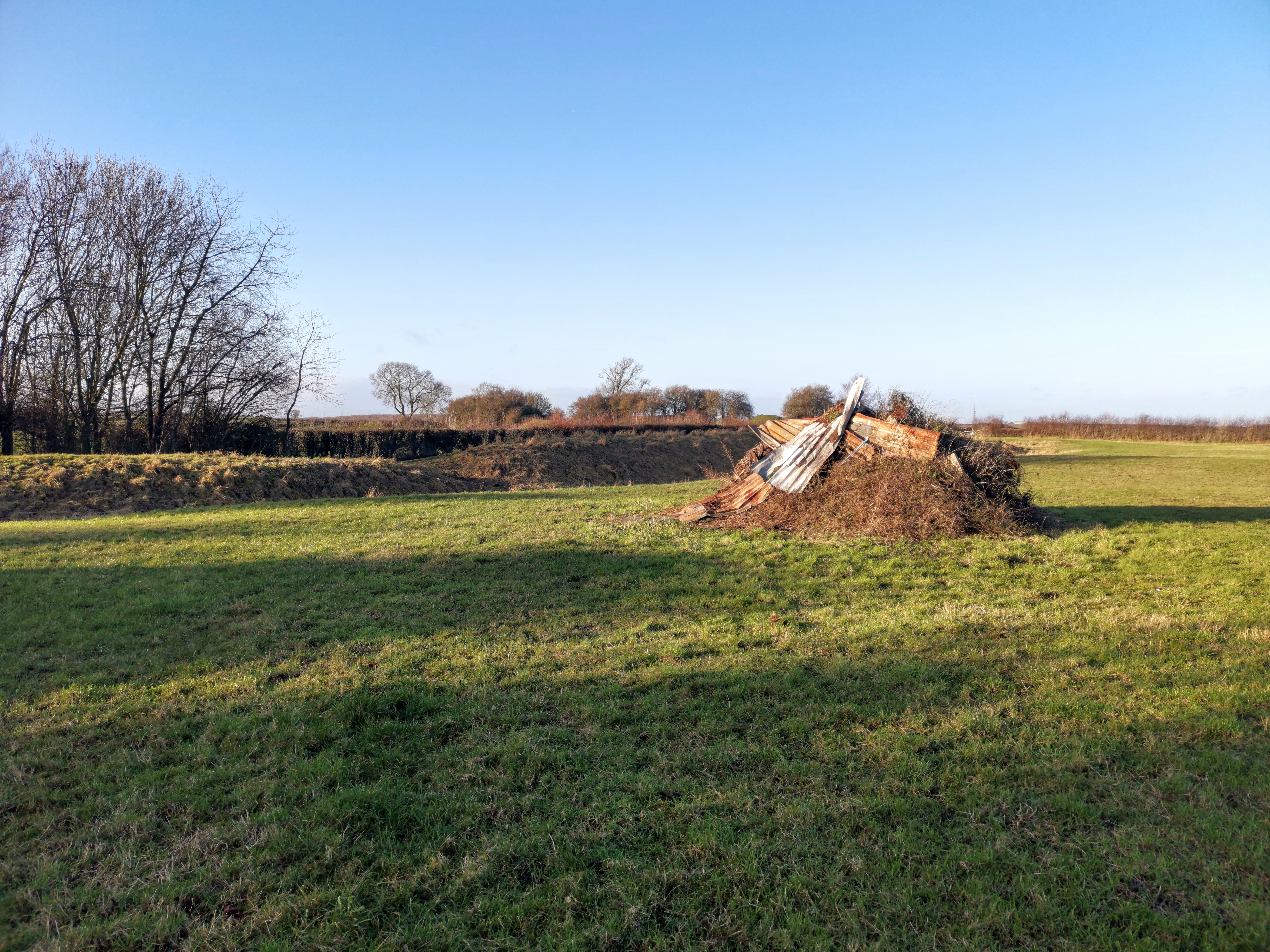 Outer bailey bank and large pile of rubbish taken at approx. SK 7217 6742 looking NW