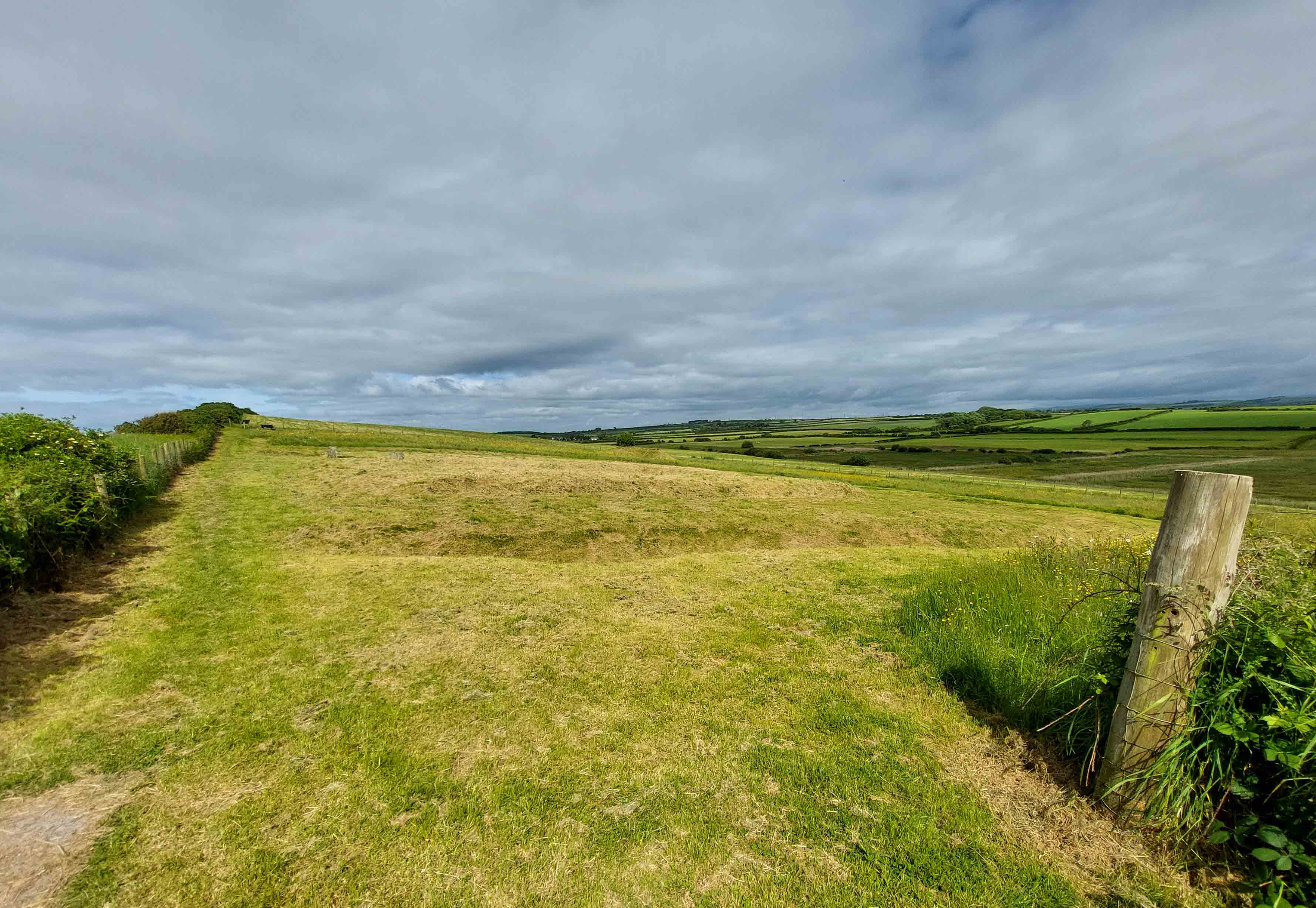 Following the path, almost to the brow of the hill, a ditch runs horizontally to your right - the southern edge of fort.