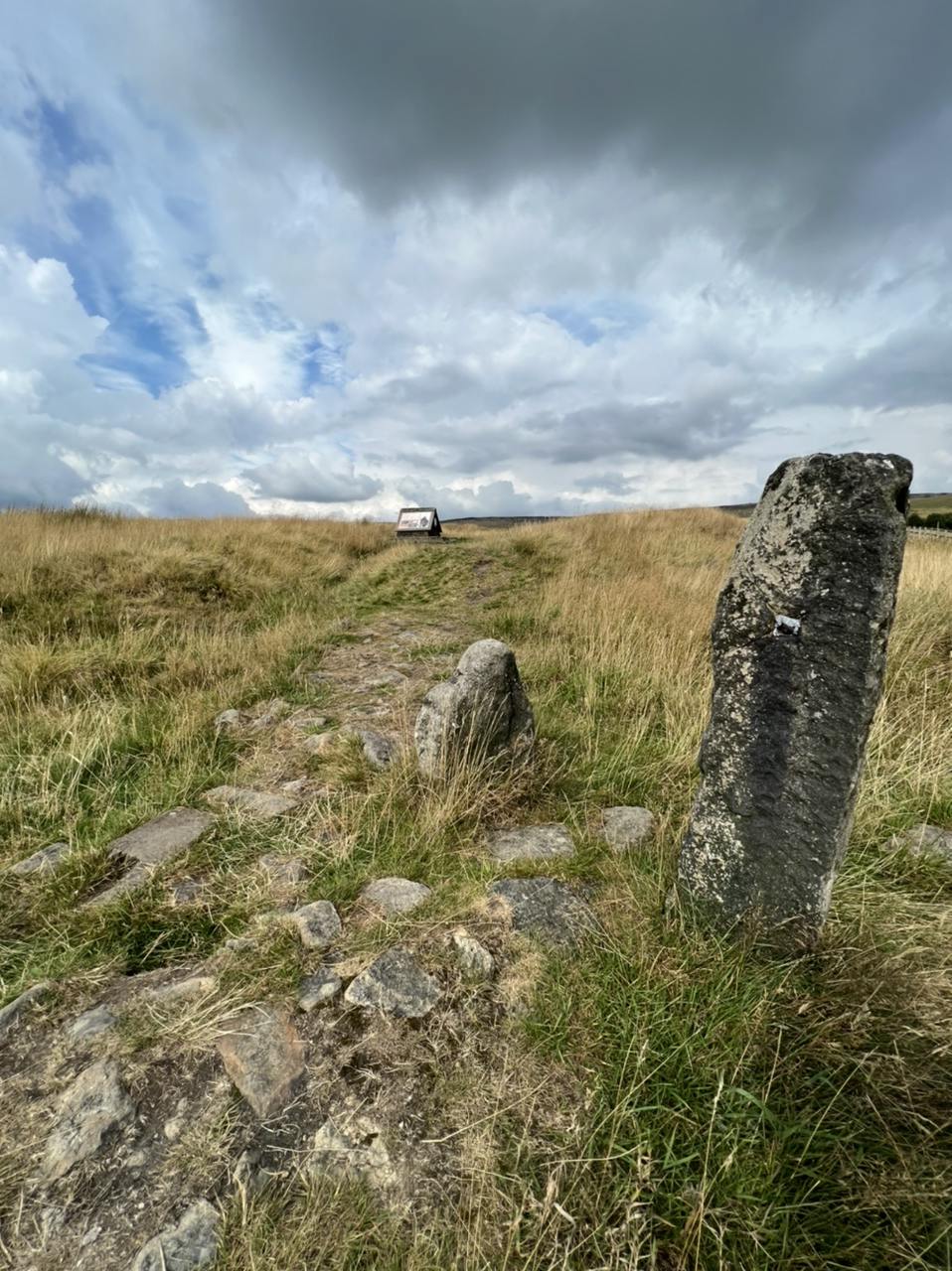 Two standing stones, and buried stones indicating the site of the wall to the fort