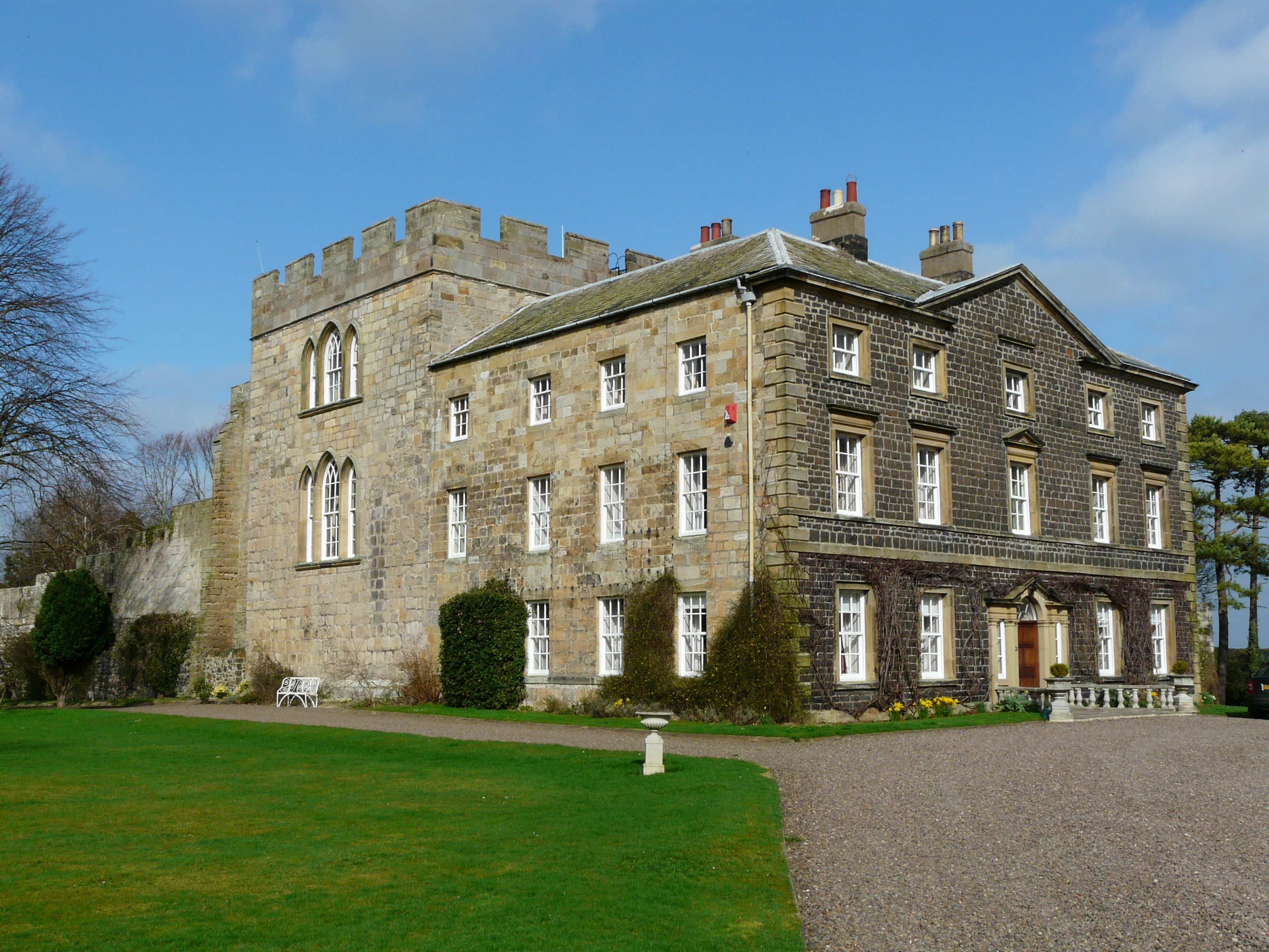 medieval tower of 3 storeys with 18th century Gothic windows, attached Palladian-style 18th century country house