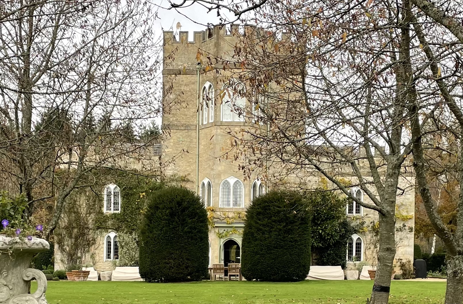 West front seen across lawn from front gate.