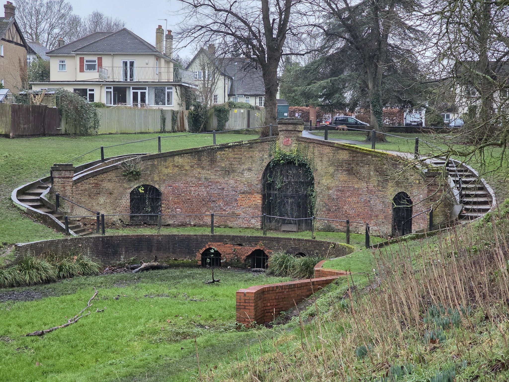 Curved brick feature in suburban park