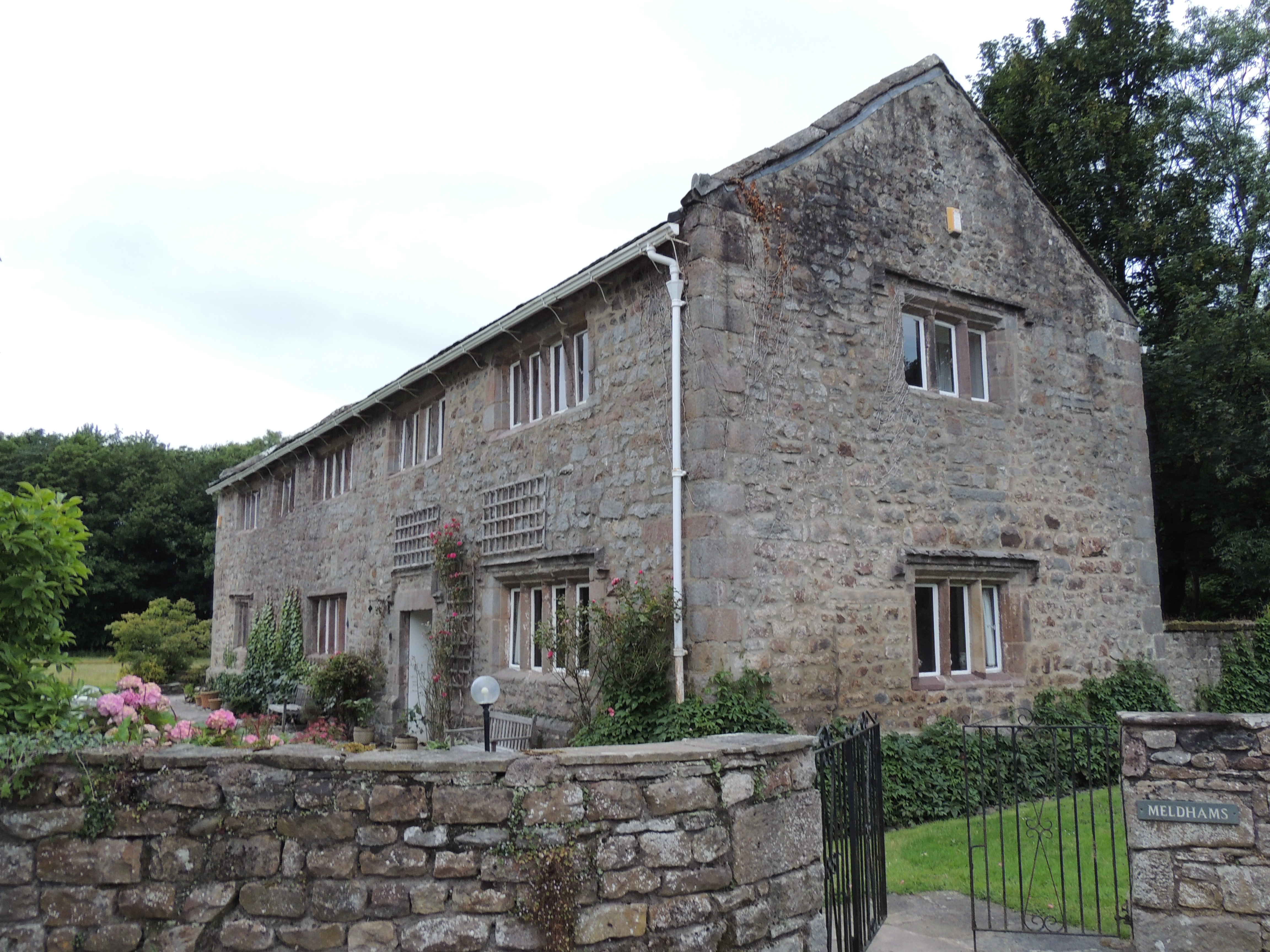 Meldhams. Former stable block west of Ashton Hall in Thurnham, now converted into a house. 