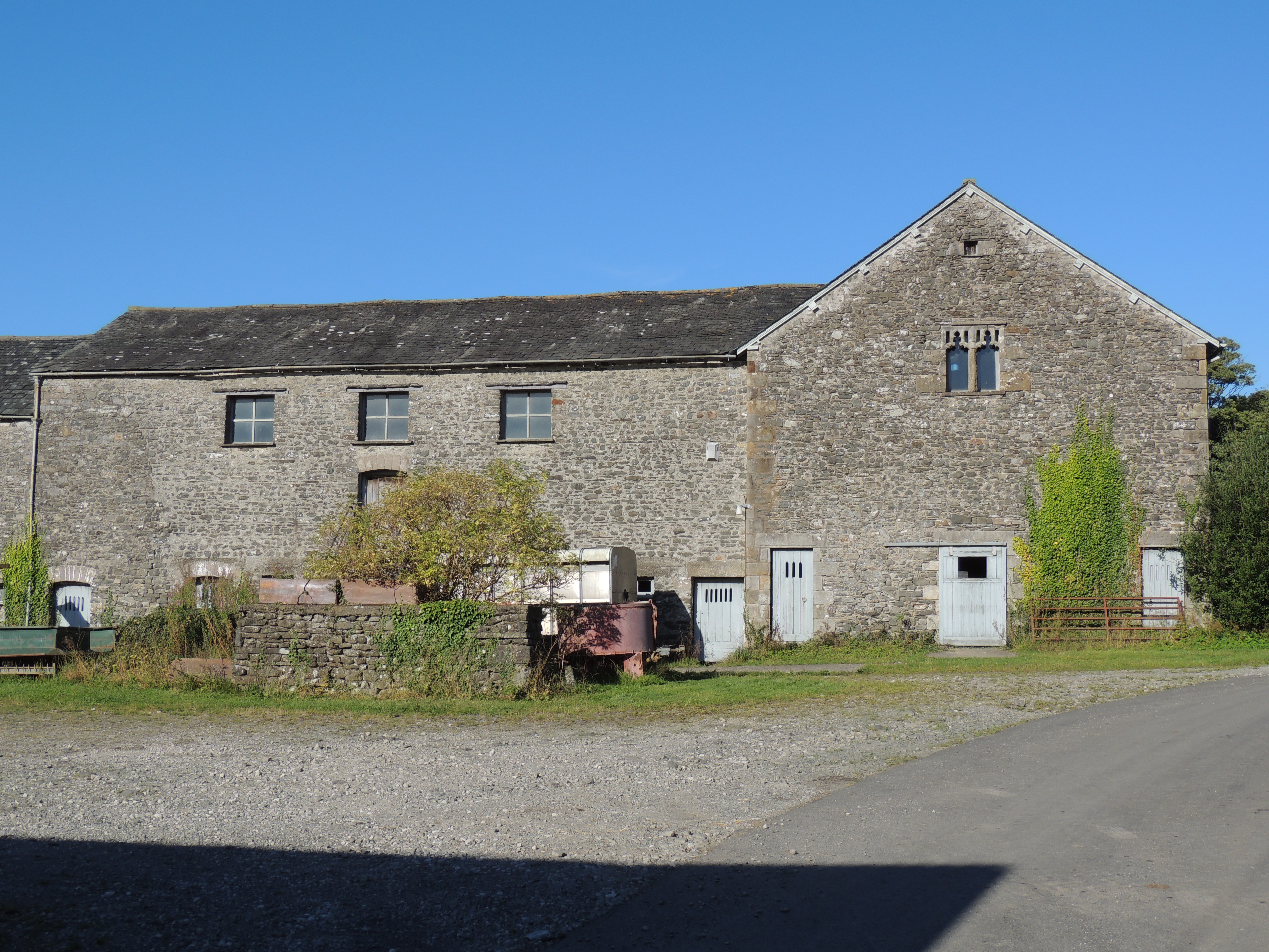 Bank barns attached at right-angles to the east of Preston Patrick Hall.