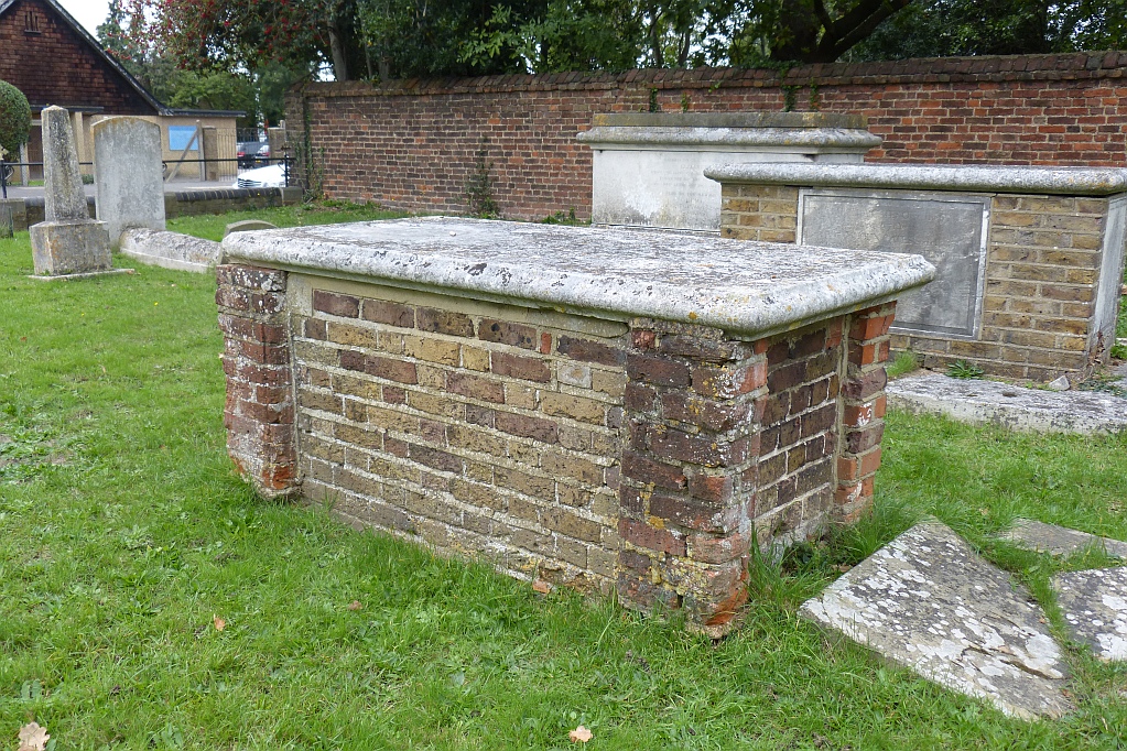 Brick chest tomb in front of Gates family monument