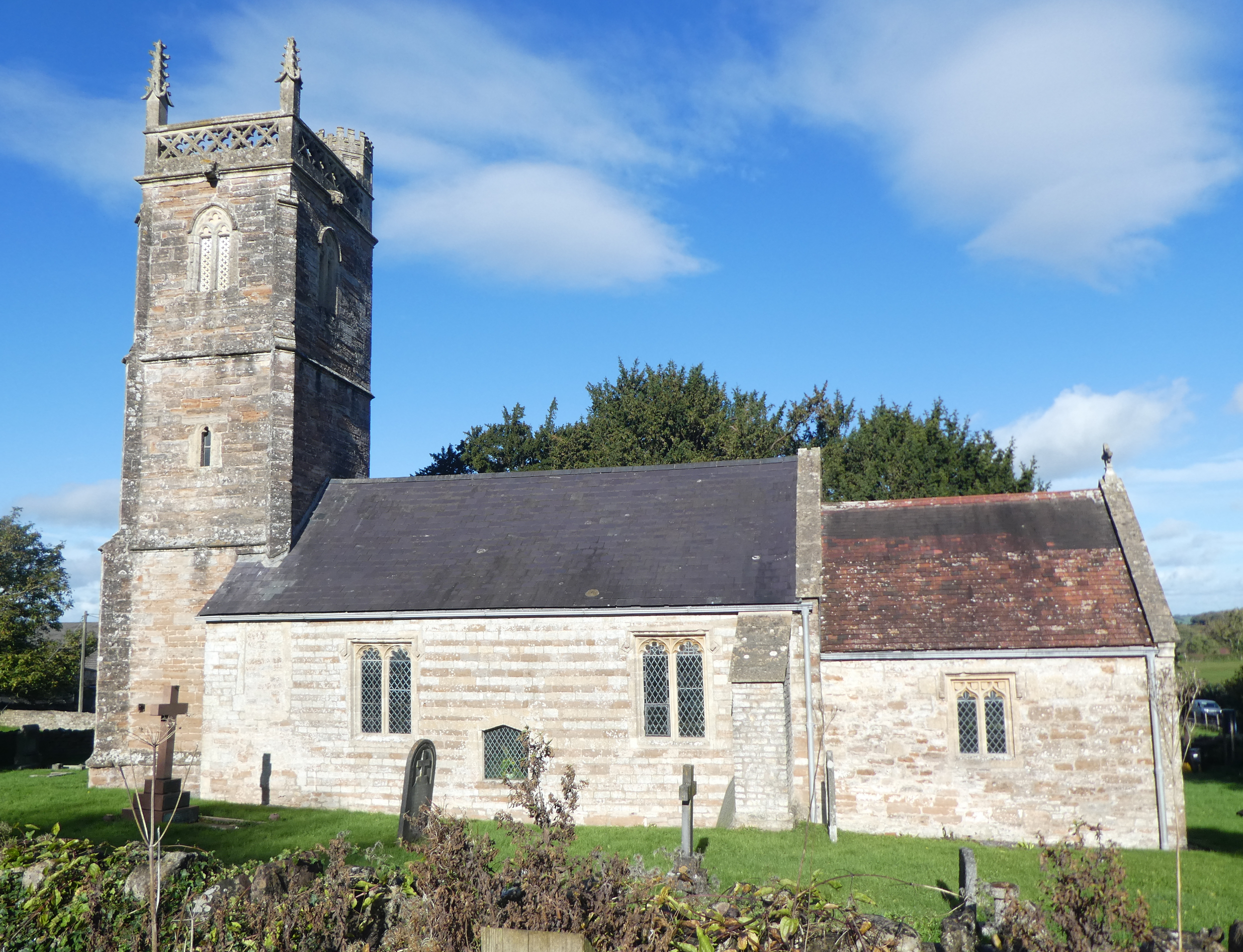 Side view of 13th Century church, with a steeple (and a spirelet)