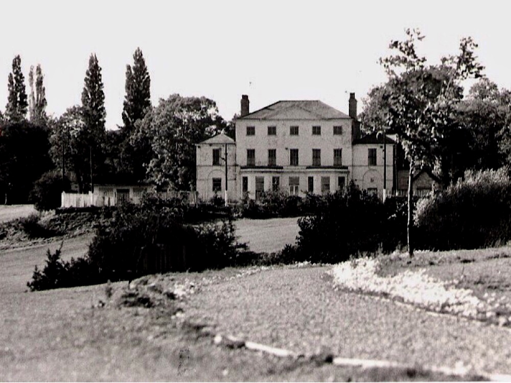 The Park Club
circa 1984
gravel path directing the view up the across grass field to white mansion set between tall tree