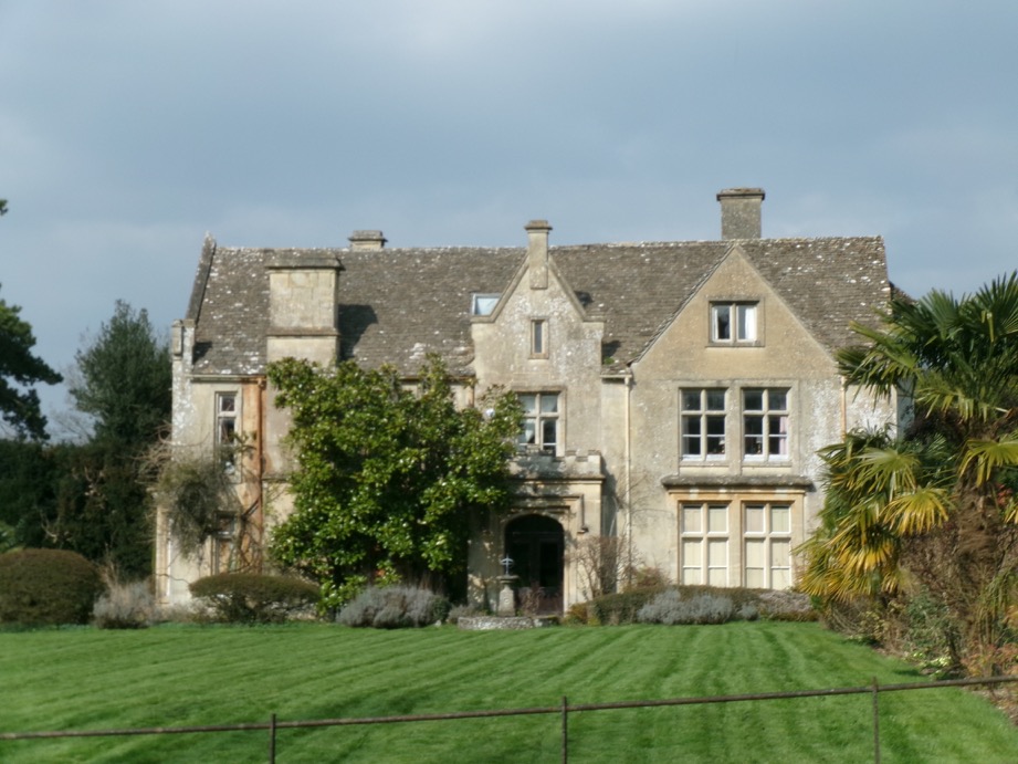 The south front seen across the lawns from the church track.