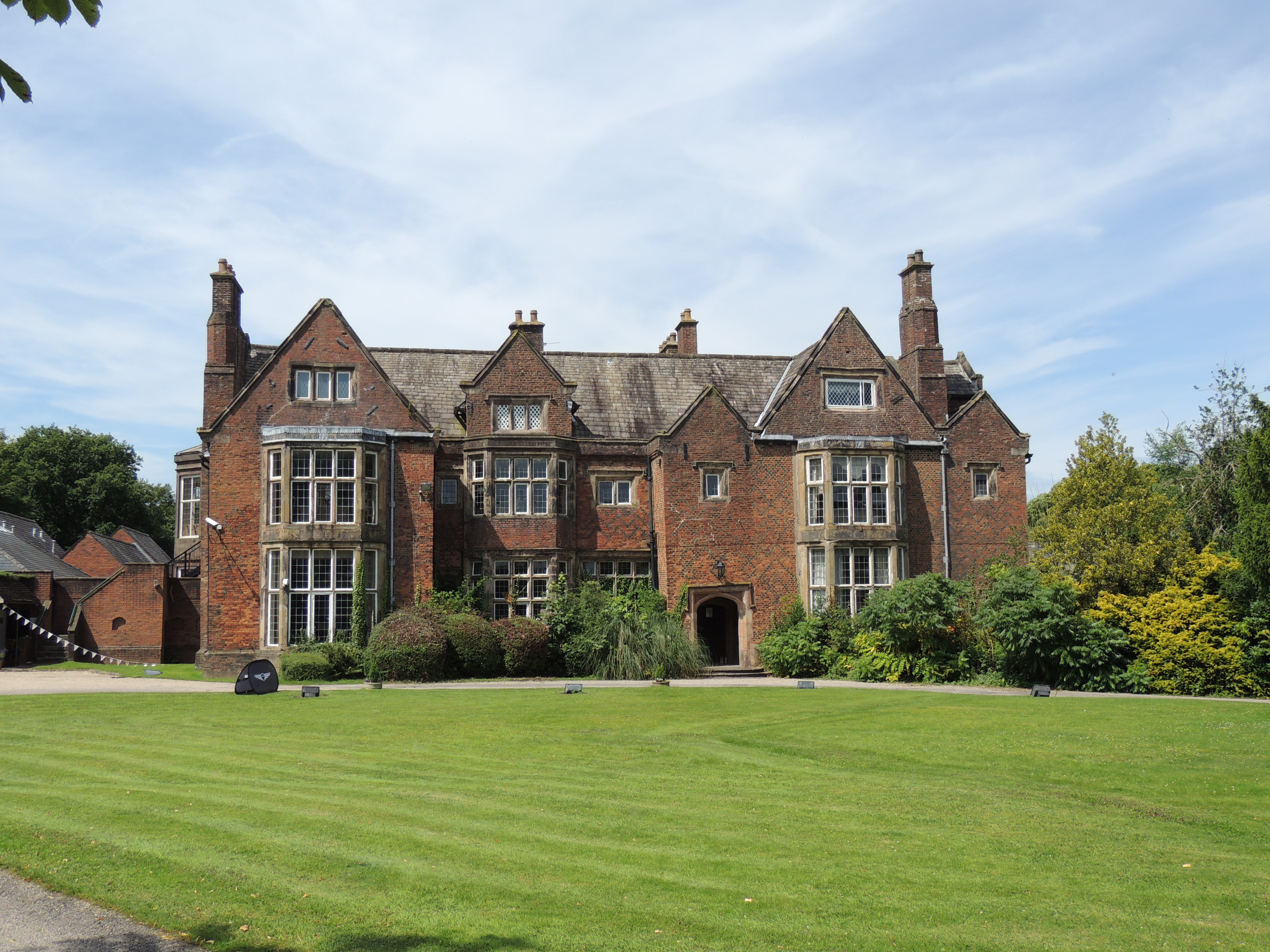 Heskin Hall. Manor house, dated 1670 on rainwater head, but probably earlier. Altered and enlarged in 19th century. 