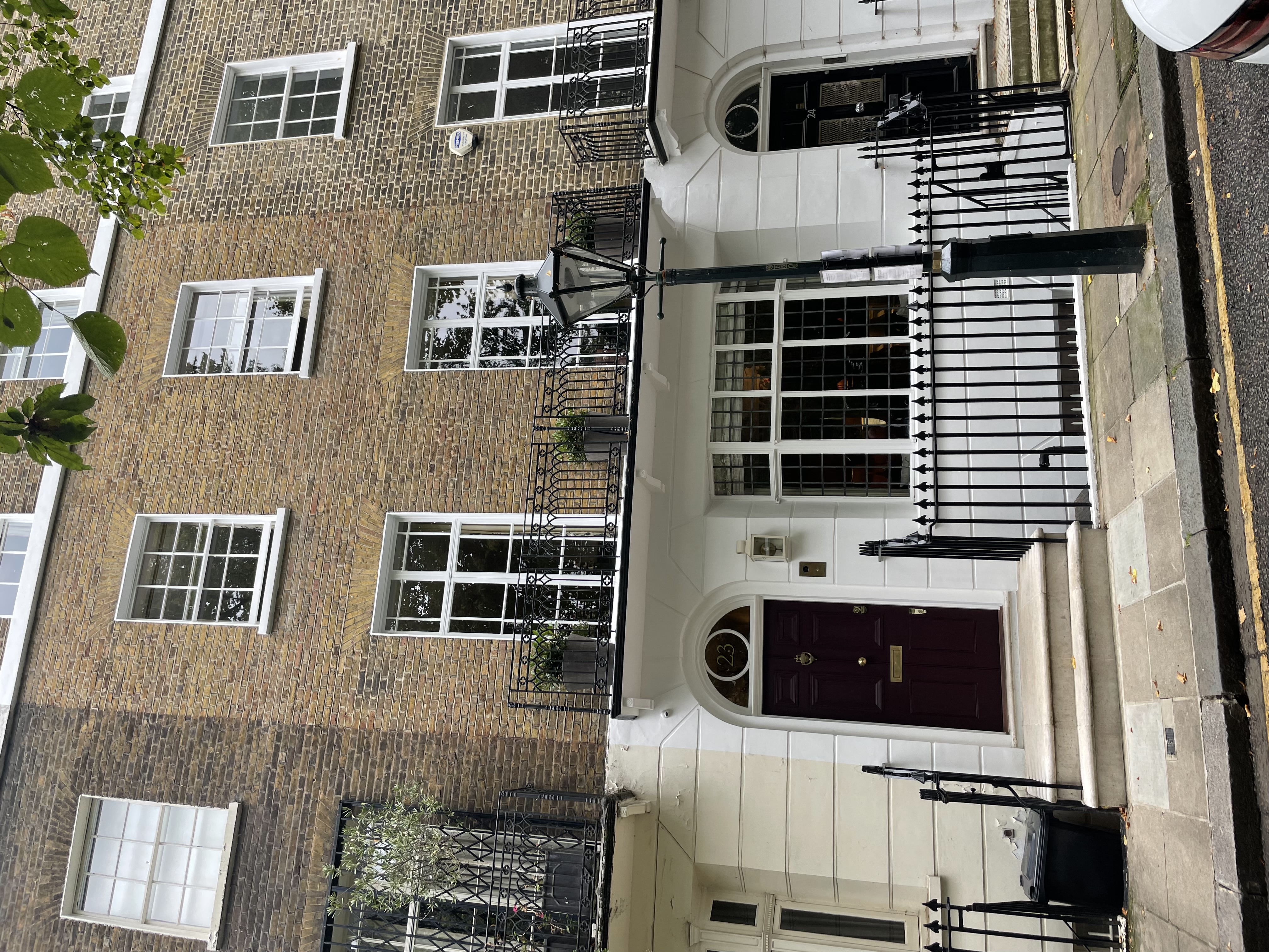 23 Brompton Square, in the middle of this run of listed properties.