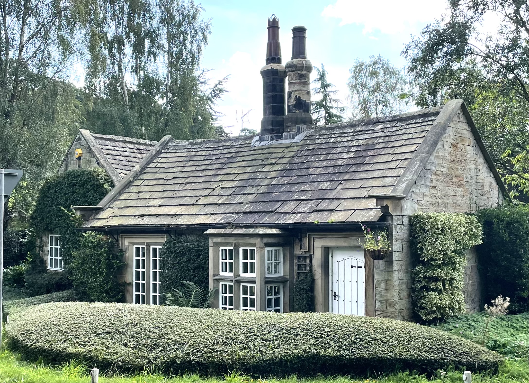 Cottage front from north across Lane Head Road.