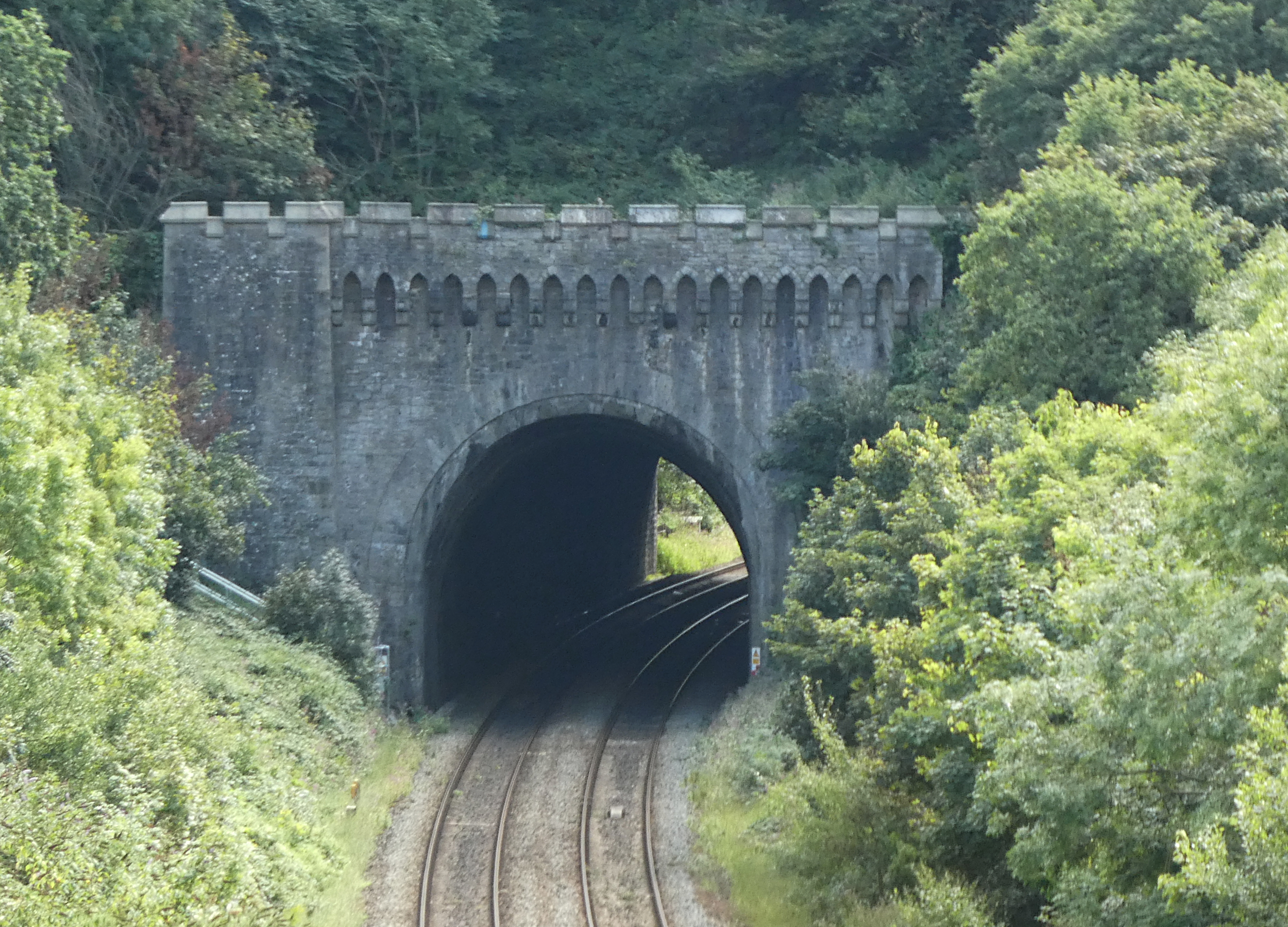 An ornate, castellated tunnel entrance