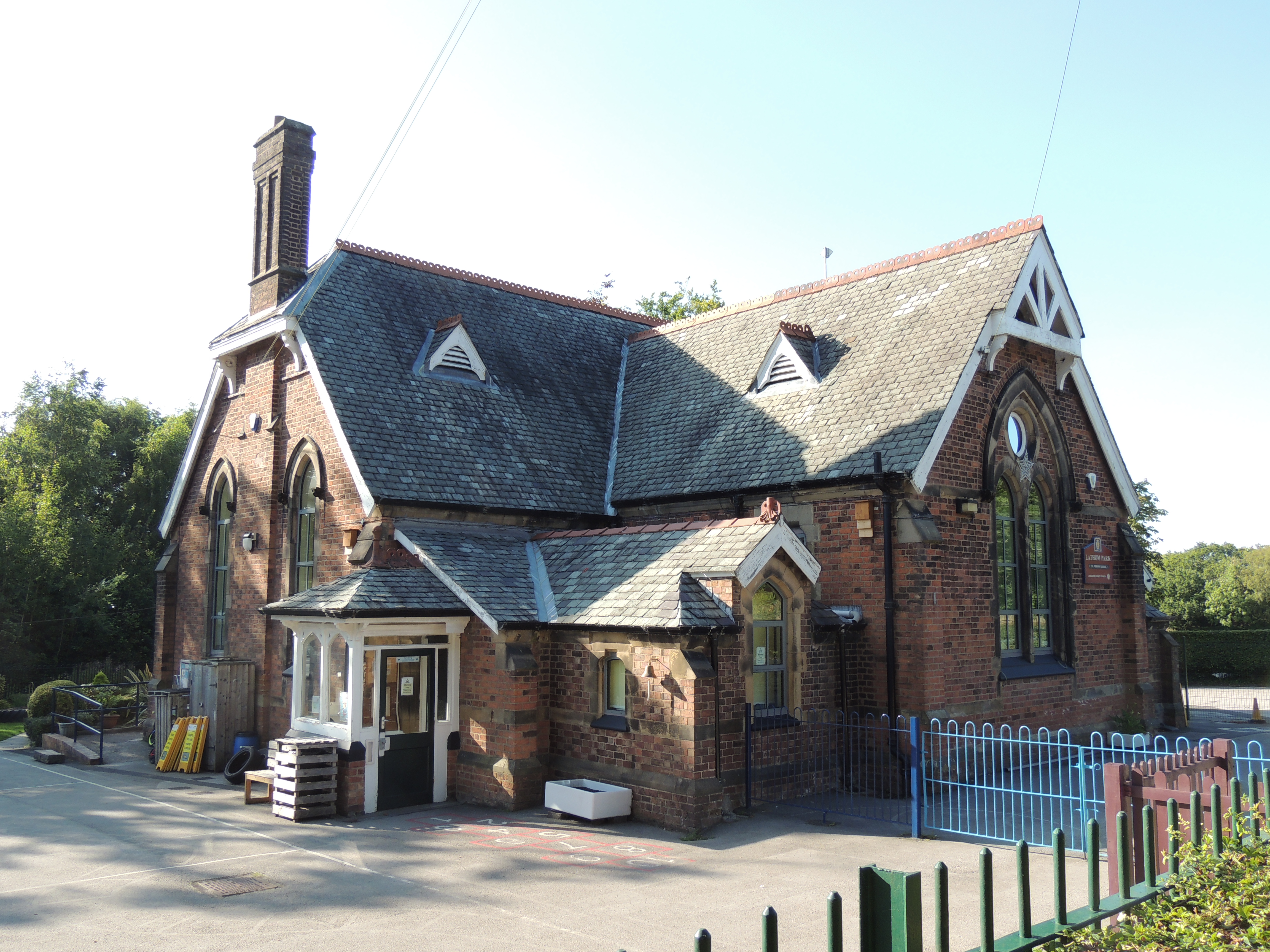Lathom Park C. of E. Primary School, dated 1881, with C20 additions. By Thomas Kissack, for the Earl of Lathom.