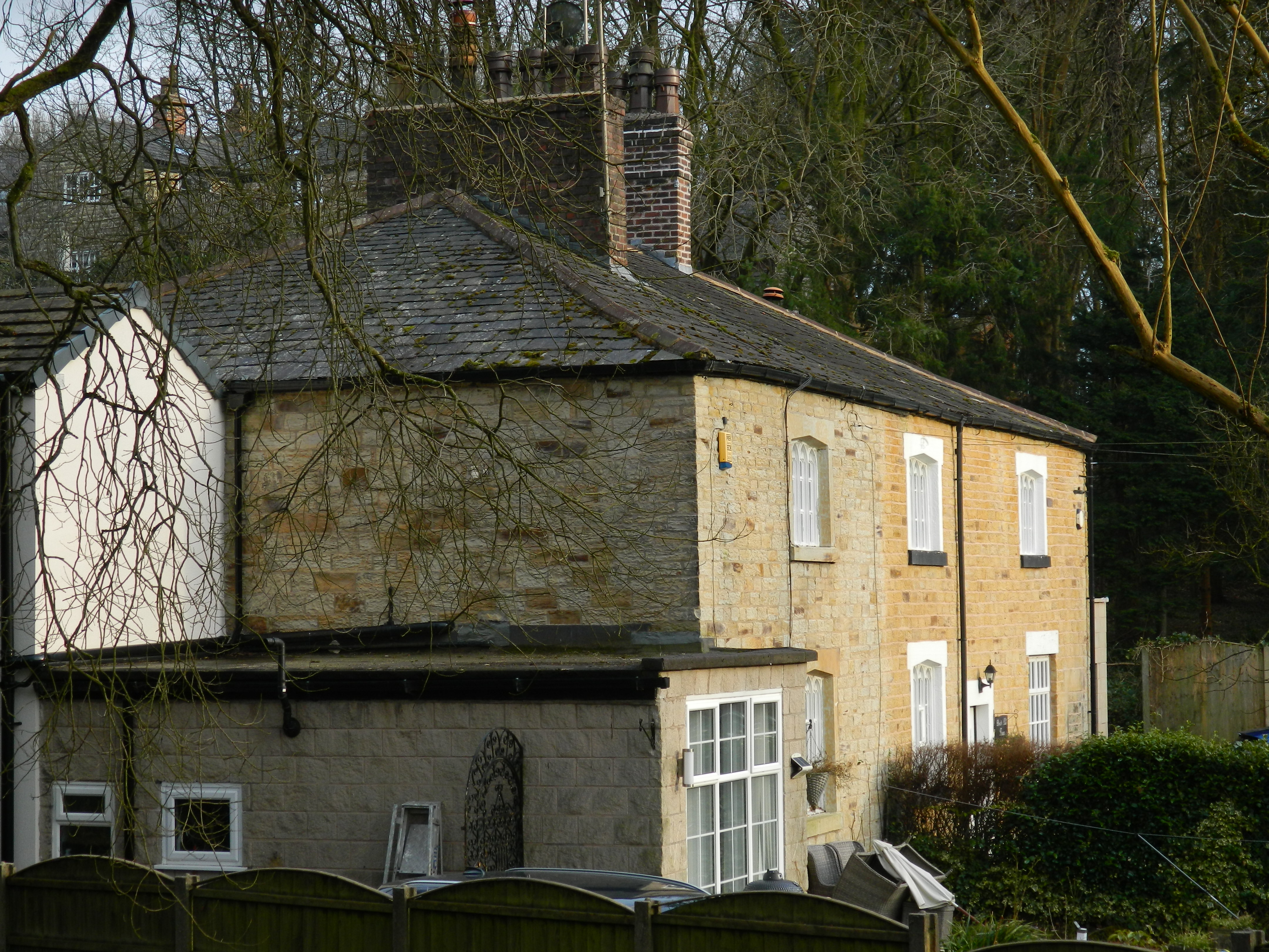 Brock Mill Cottages in the Haigh Parish of Wigan.  Two houses with a lintel, which has an oval inscribed: "EB/1821".