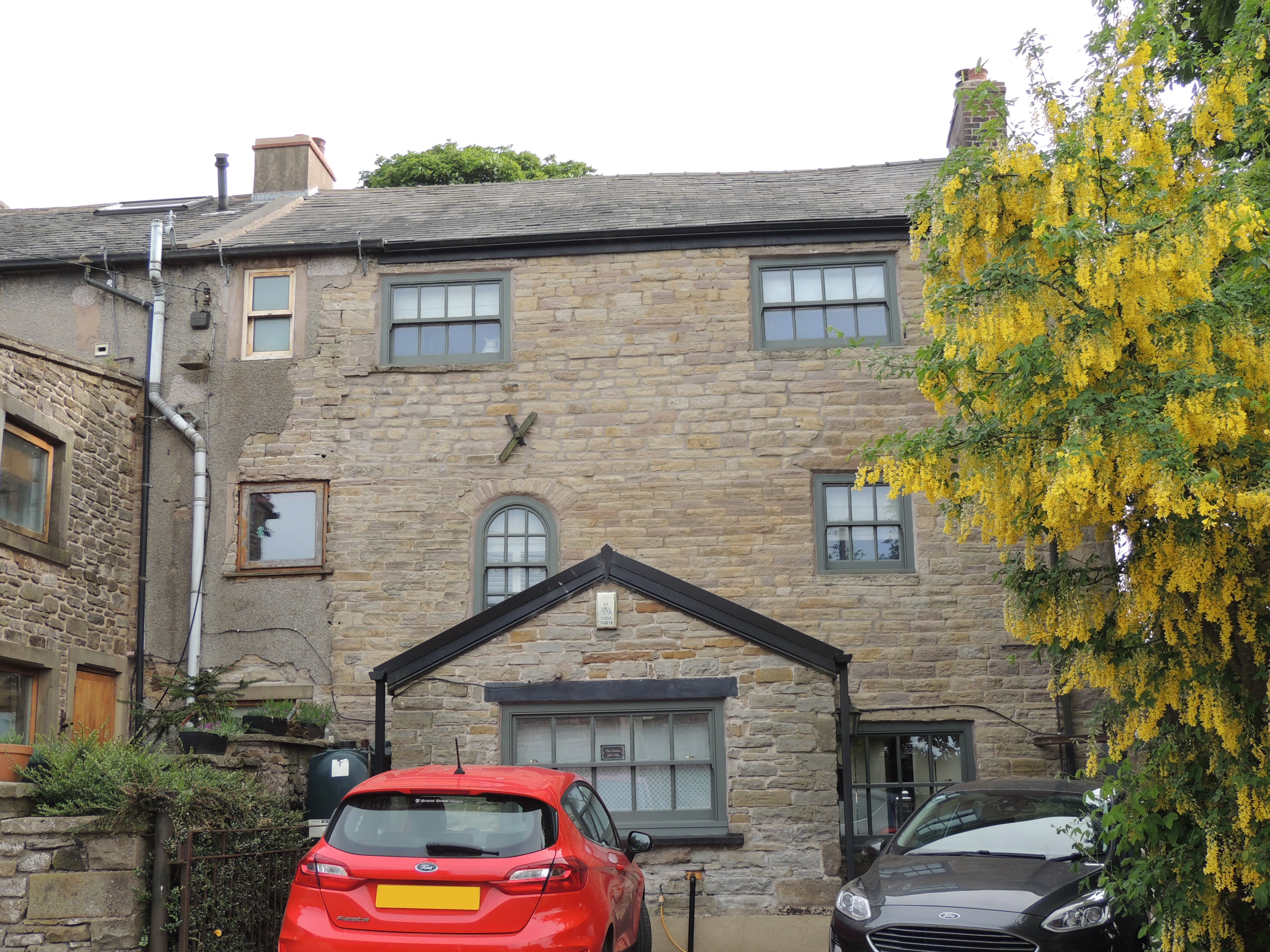 The Manse and Silk Hall Farmhouse in Tockholes. A house, formerly called Silk Hall and dated 1764 on porch.