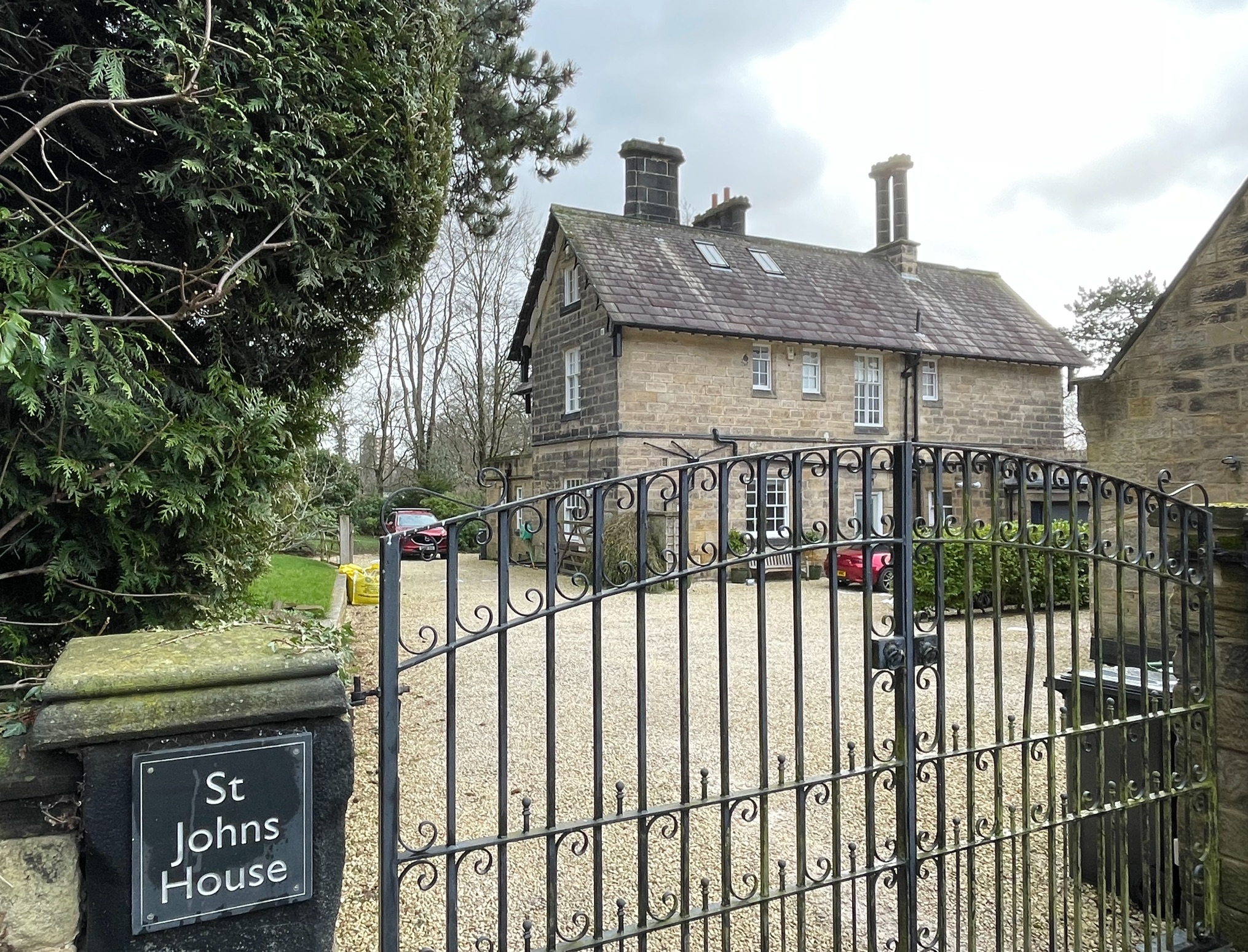 View from North West showing first floor string course and chimneys