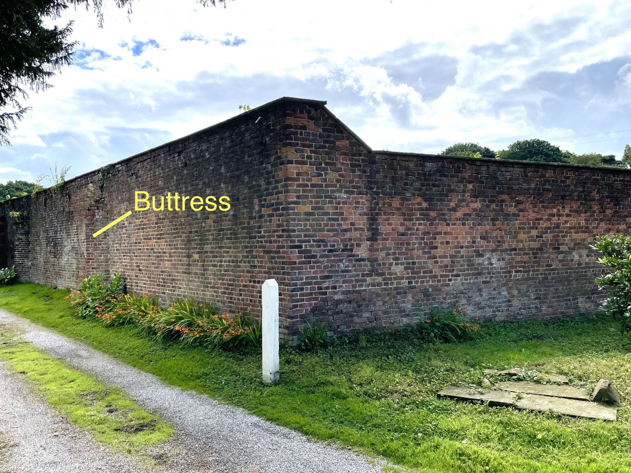 View of north west corner showing triangular buttress to north wall.