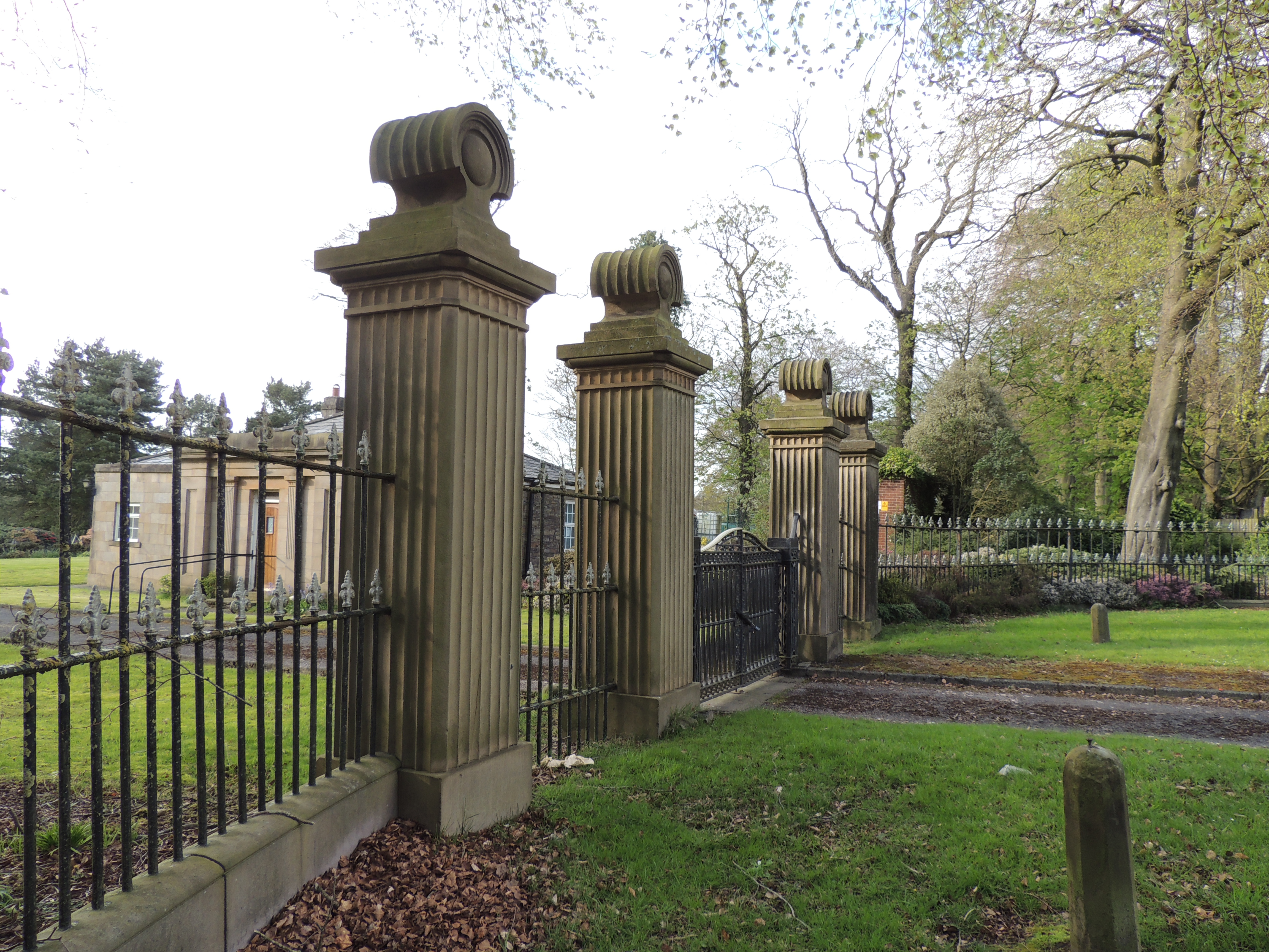 Gate piers and railings at Wigan Lodge to Duxbury Park extending about 30m either side of gates.