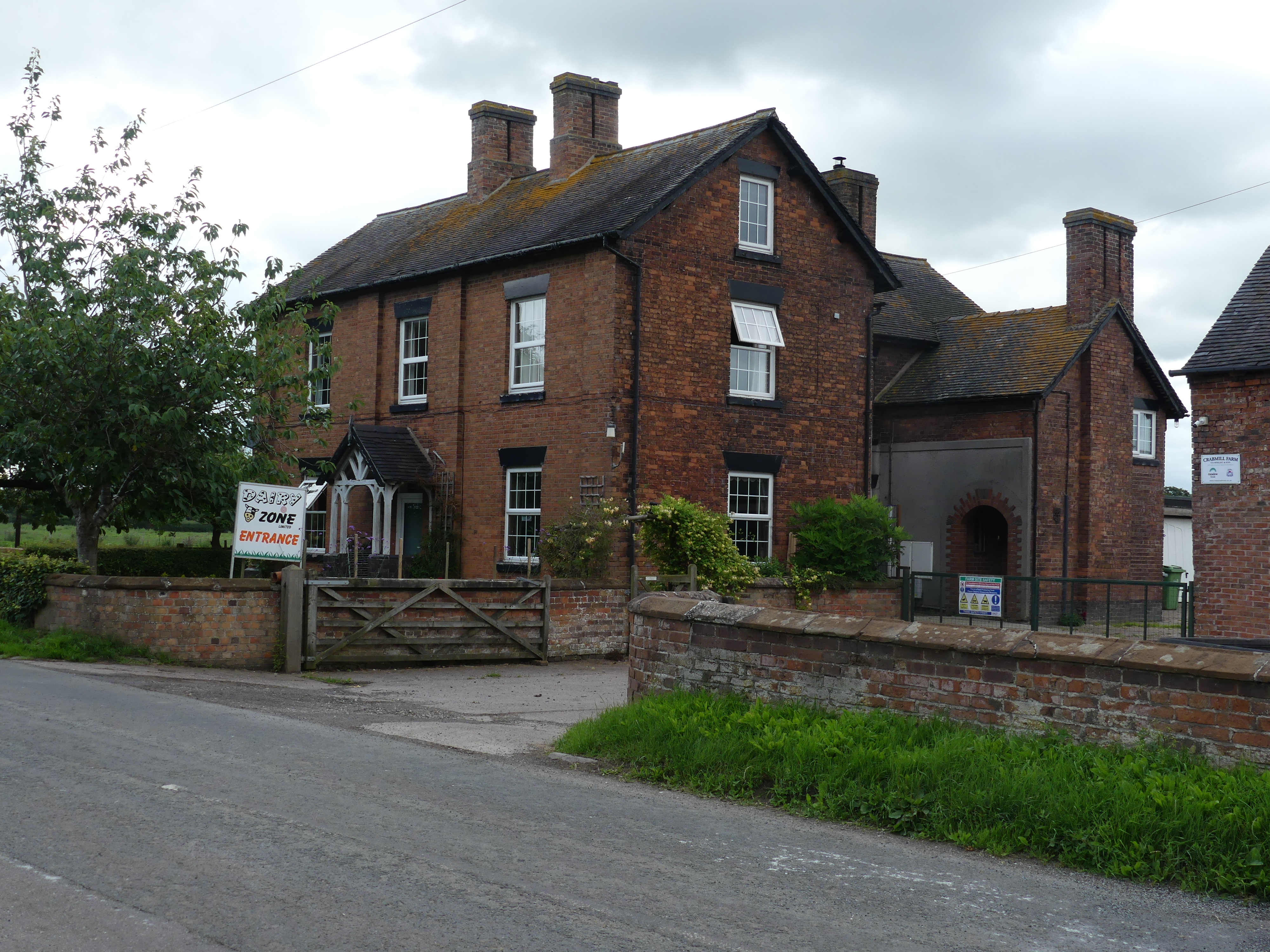 Brick farmhouse, oblique view.