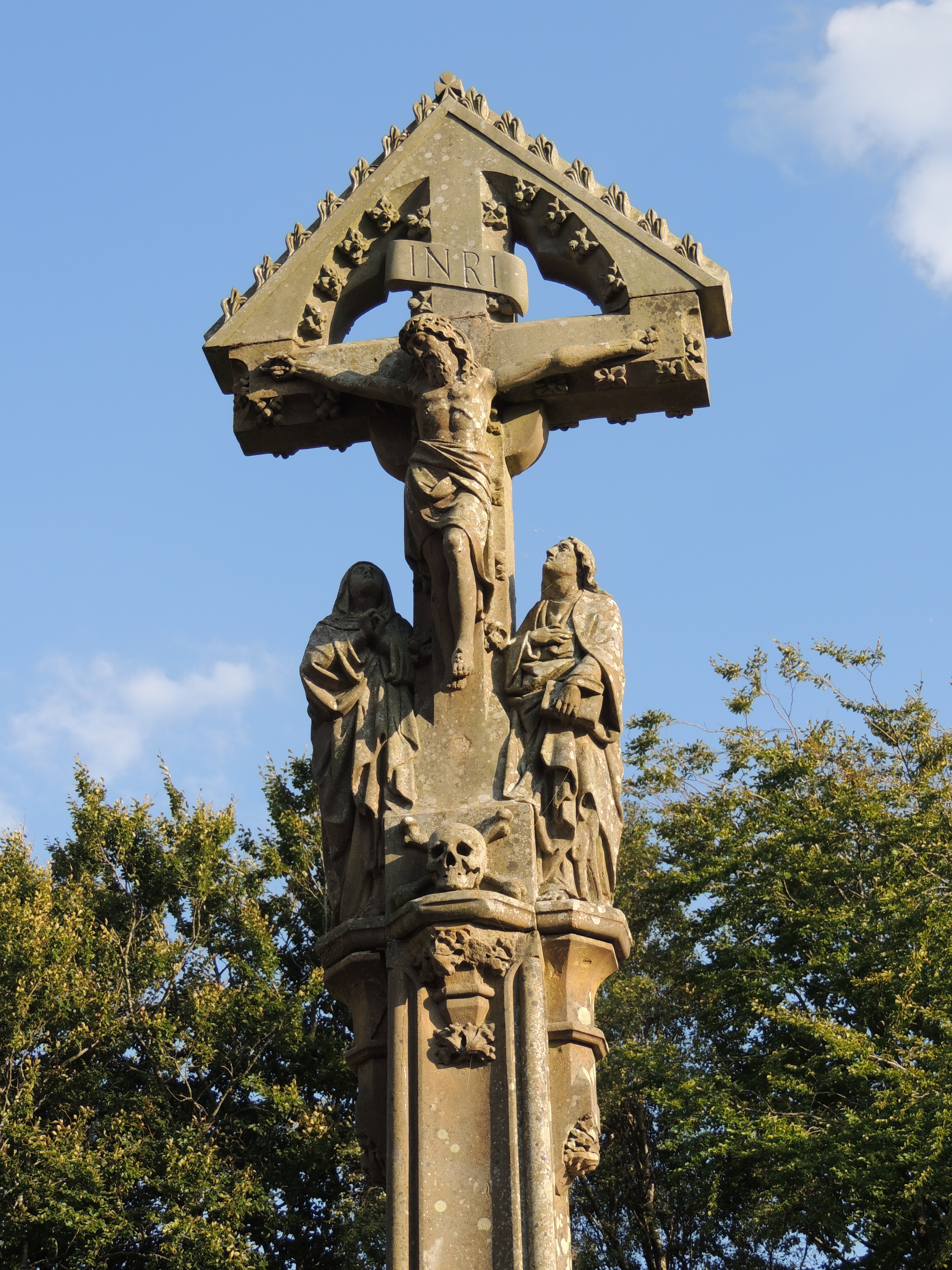 The Memorial Cross circa 10 metres west of St. Hubert's Church in Great Harwood was erected by the congregation in 1888.