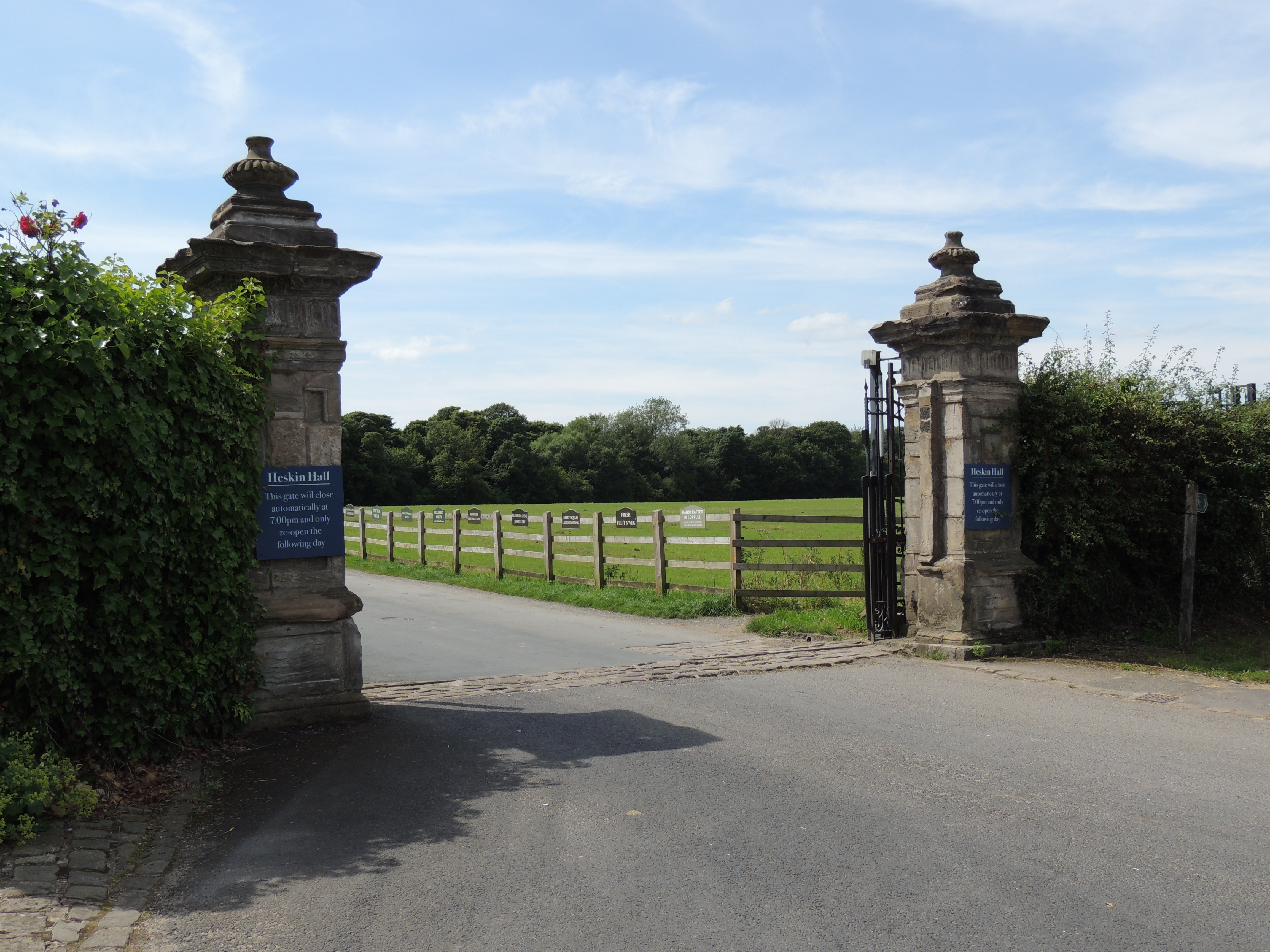 Gate Piers at entrance to the drive to Heskin Hall. Two dressed stone gate piers, perhaps late 17th century. 