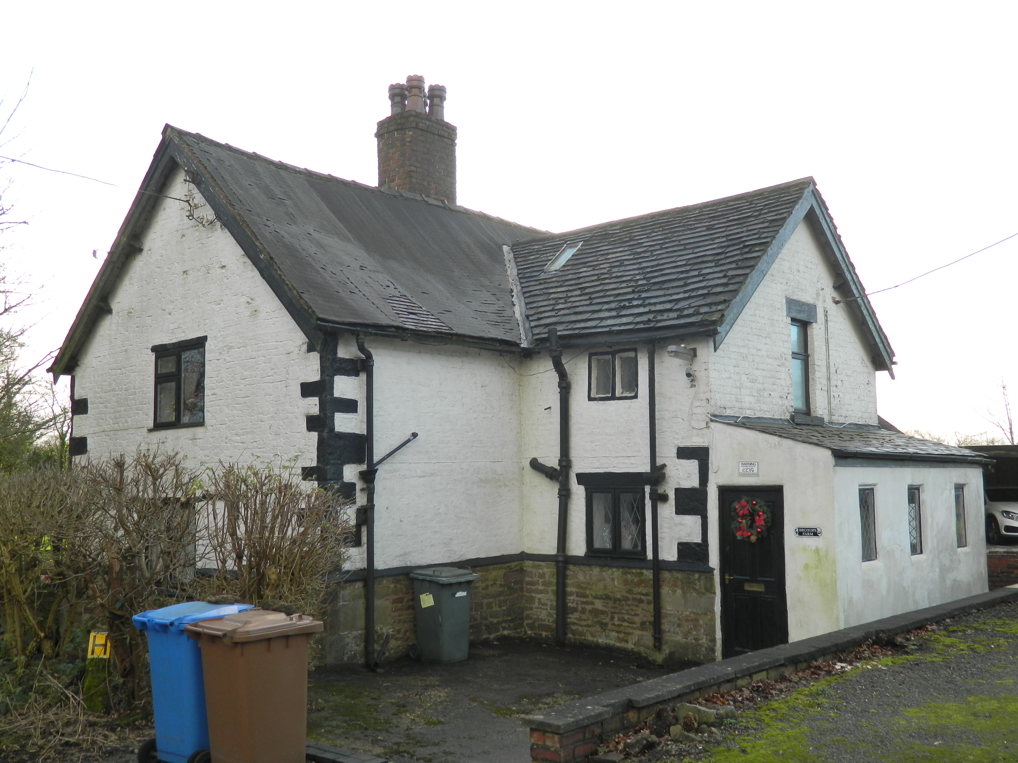 Broxop's Farmhouse. Probably early-to mid seventeenth century, but altered at some point. Brick on high stone plinth.