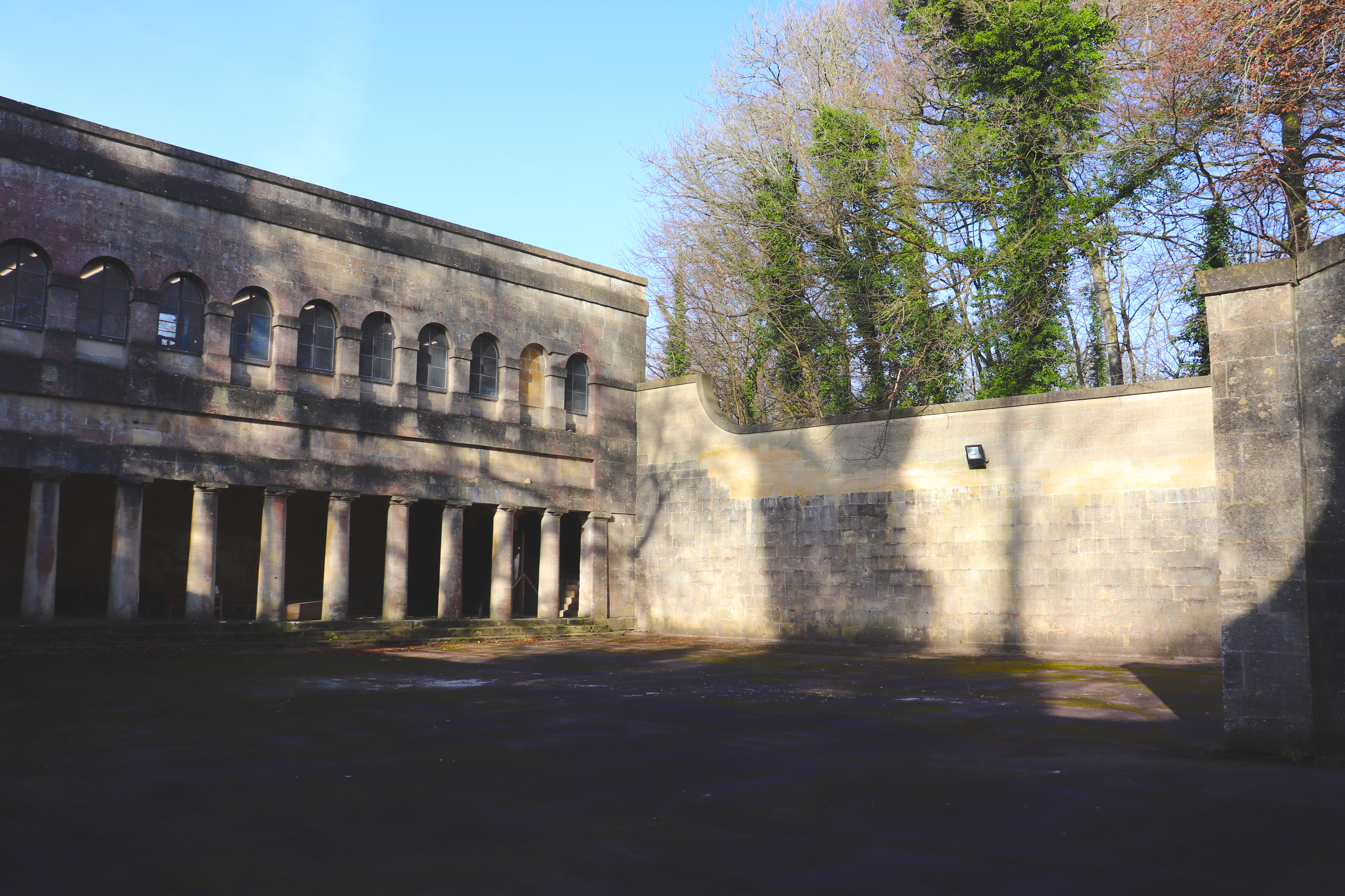Prior Park Old Gymnasium. View across ball-courts towards main two storey building.