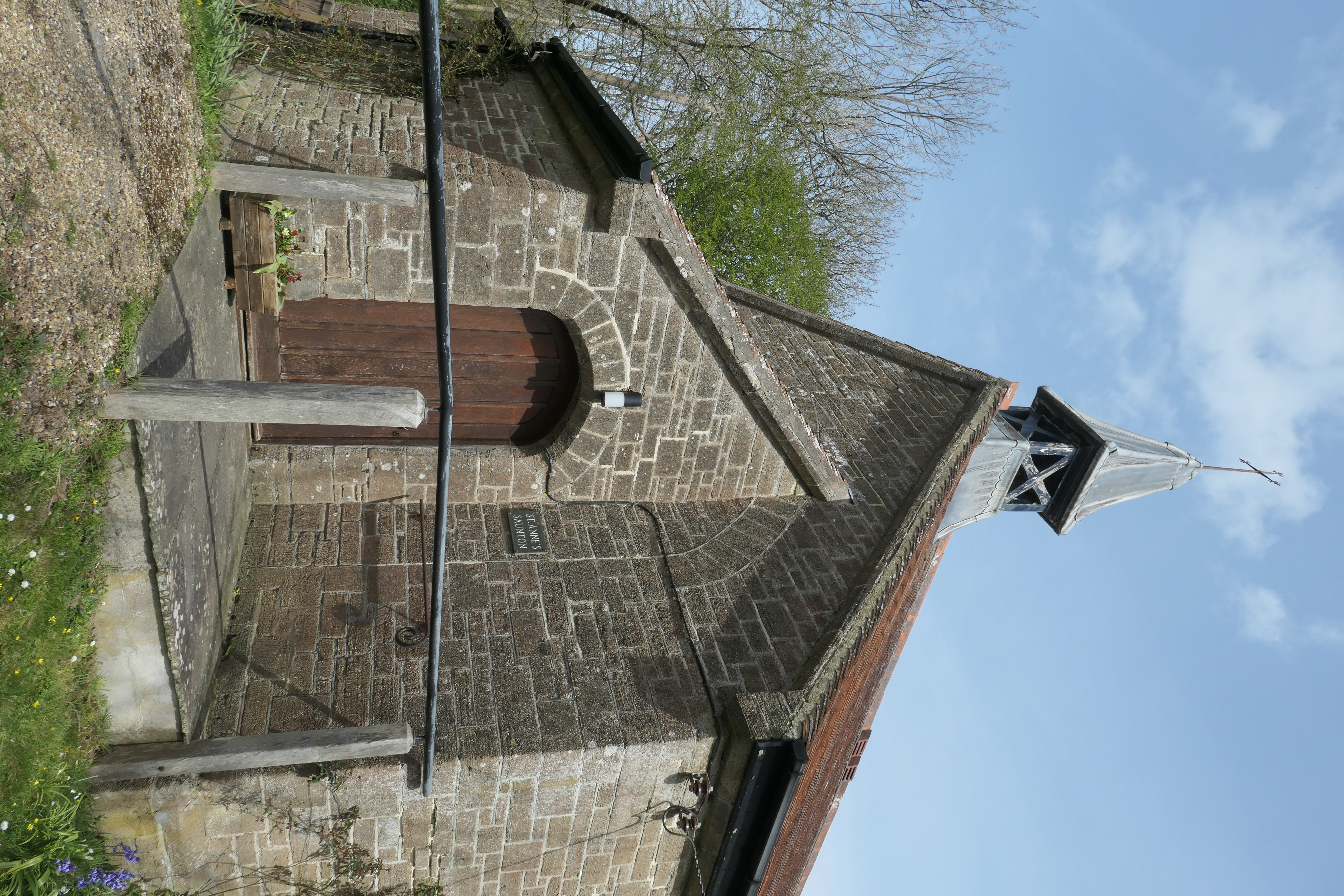 St Anne's Chapel, Saunton - arch partly obscured by porch intended as the chancel arch for a later full-sized church.