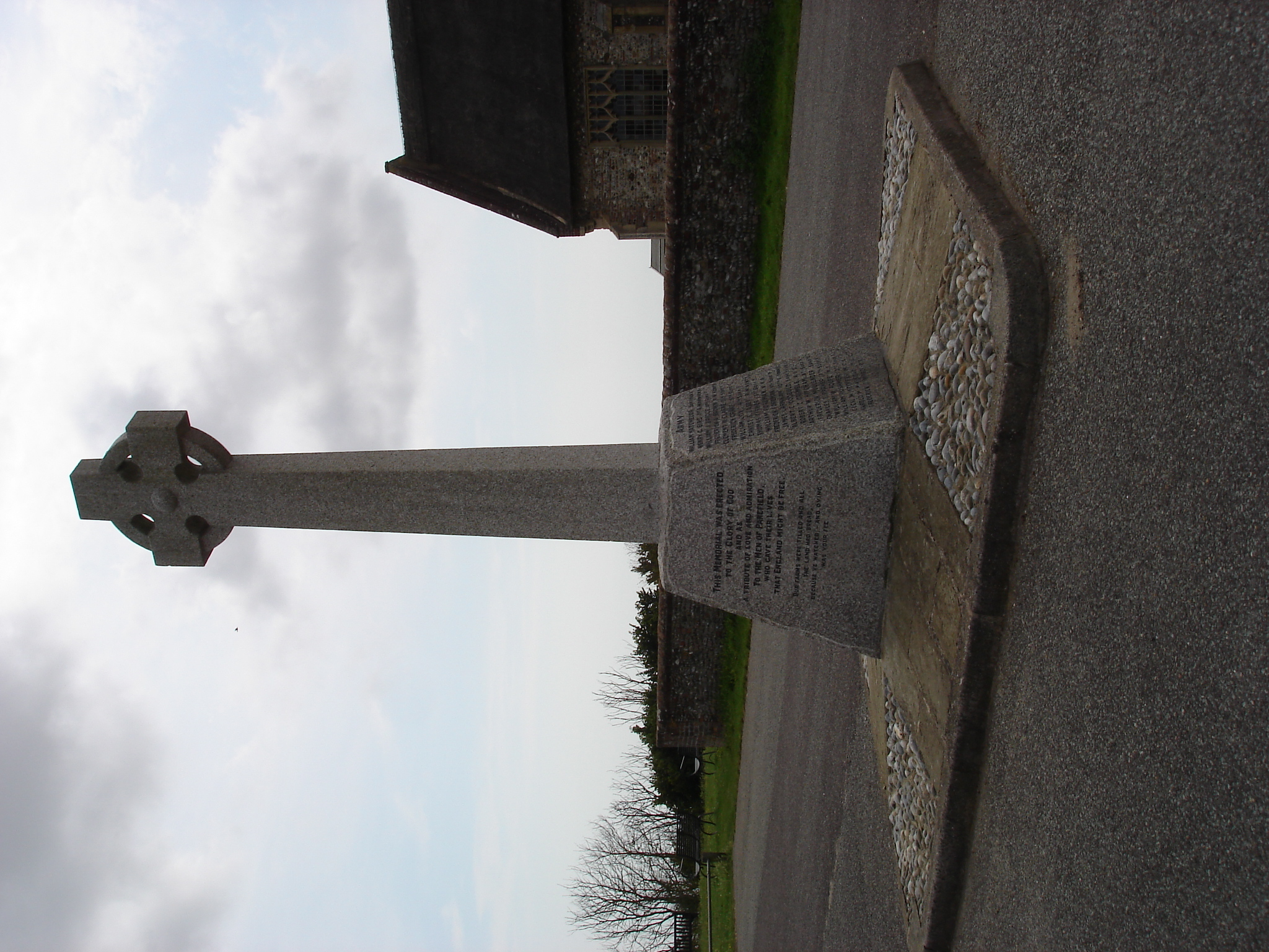 War Memorial at Pakefield Church, Suffolk. The Memorial is a Celtic cross on a granite plinth.