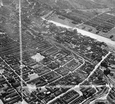The town around Freeman Street Market and Grimsby Docks Railway Station, Grimsby, 1950. This image was marked by Aerofilms Ltd for photo editing.