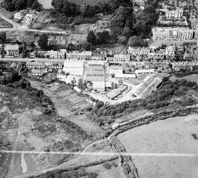 The Torbay Paint Works, Brixham, 1950. This image was marked by Aerofilms Ltd for photo editing.