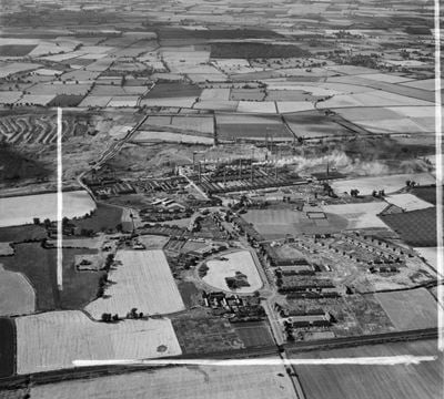 The village and Stewartby Brick Works, Stewartby, 1952. This image was marked by Aerofilms Ltd for photo editing.
