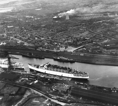 SS Himalaya moored in Buccleuch Dock, St George's Square and the town, Barrow-in-Furness, 1948. This image has been produced from a print.