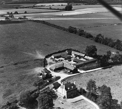 Manor Farm, Old Alresford, from the south-east, 1951. This image has been produced from a print marked by Aerofilms Ltd for photo editing.