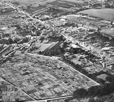 Helion's Wood Allotment Gardens and the town centre, Haverhill, 1929. This image has been produced from a copy-negative.