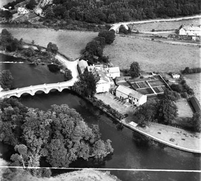 Newby Bridge and the Swan Hotel, Lakeside, 1951. This image has been produced from a print marked by Aerofilms Ltd for photo editing.